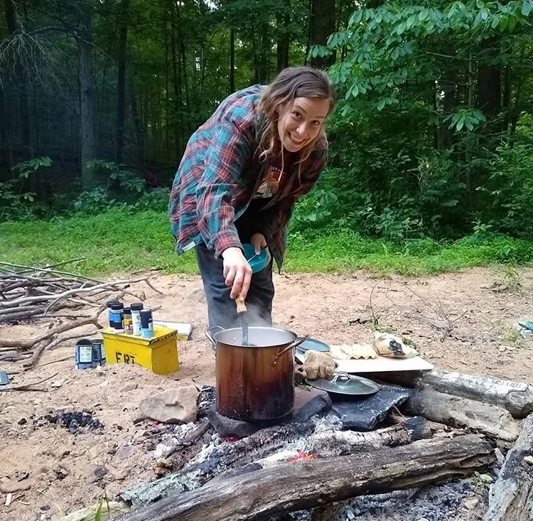 Claire cooking dinner for her team over the campfire during their ten day project in Shawnee’s Lush Creek Wilderness Area. Photo by Brigid Mulroe.
