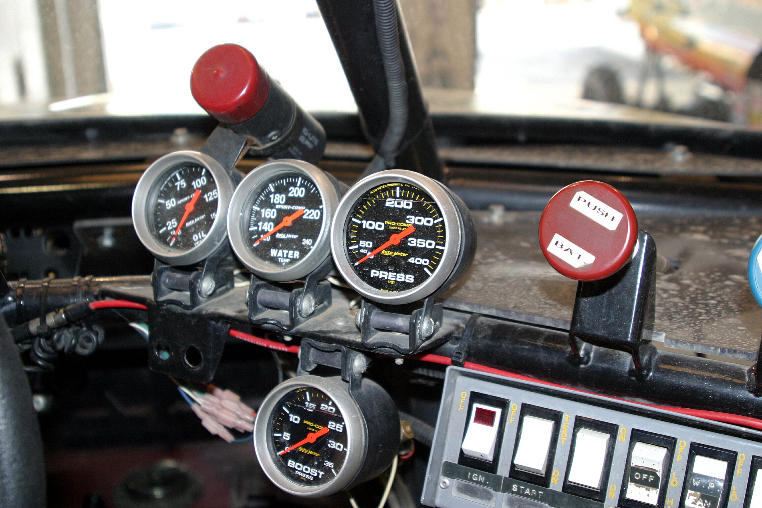  The cockpit of Bigfoot is not unlike that of a homebuilt airplane. Purposeful gauges and mysterious switches make up what passes for a dashboard. 