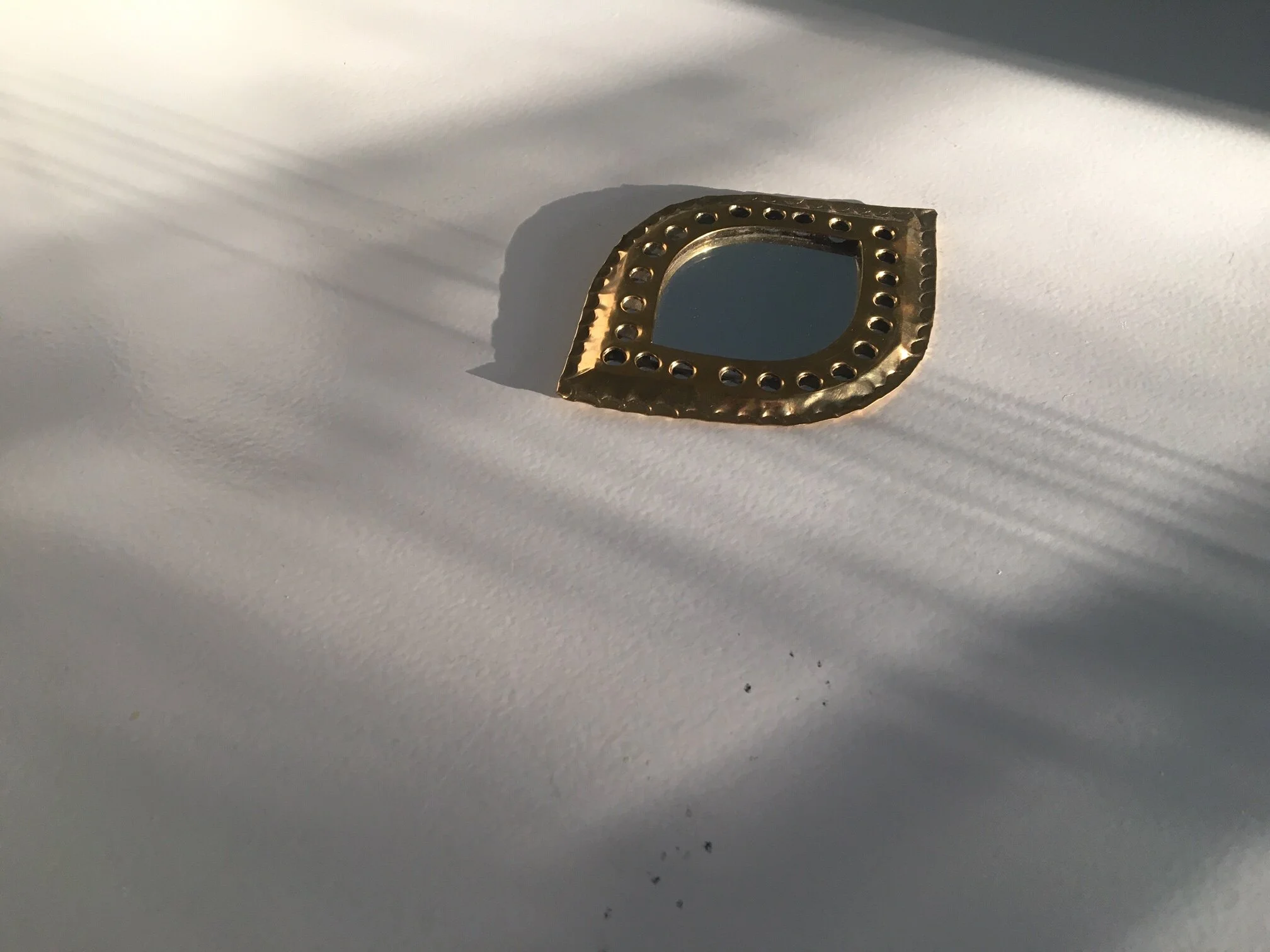 round mirror brass