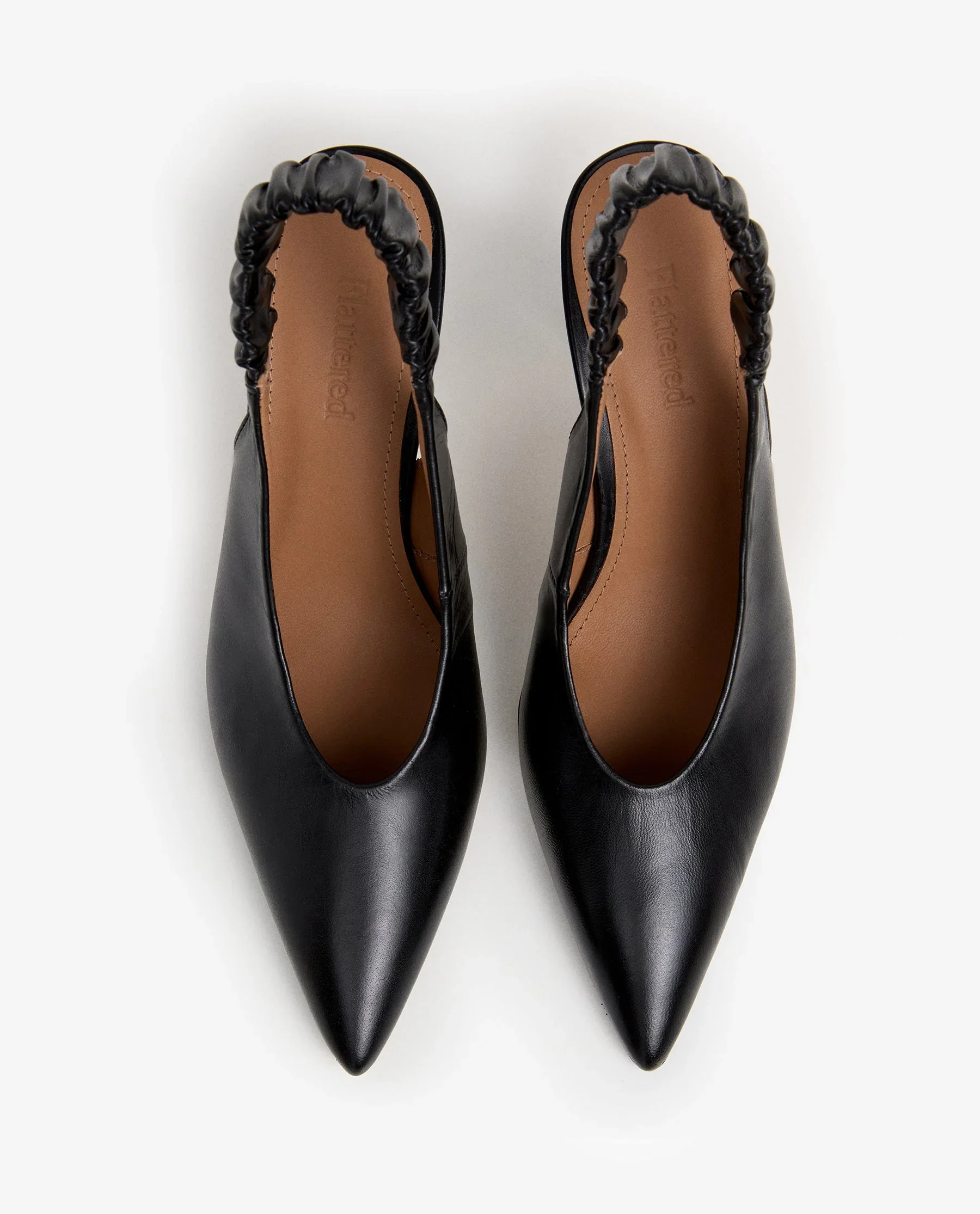 FLATTERED-LILLIAN-KAISERBLACK-TOP.webp