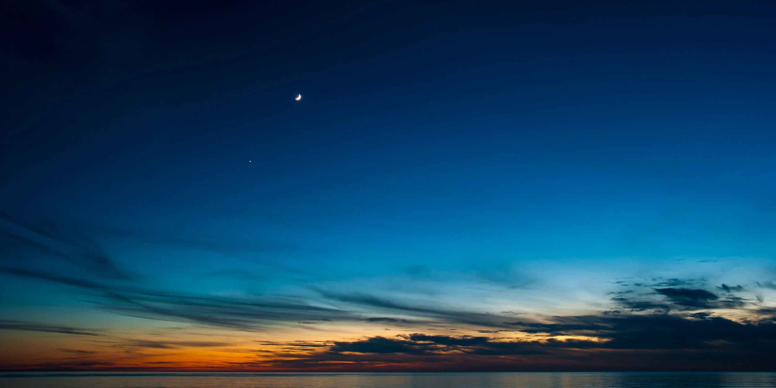 Last Light || Pismo Beach sunset with a crescent moon, 5s exposure.
