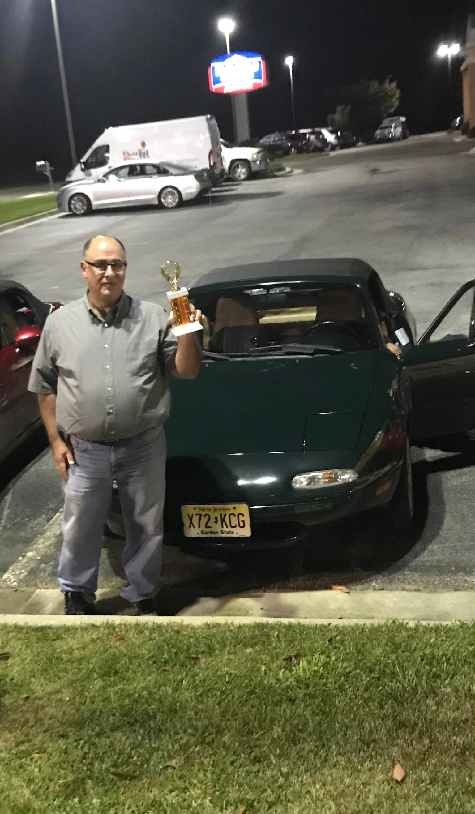 Doug Weierich with his trophy and car that won the NA division.