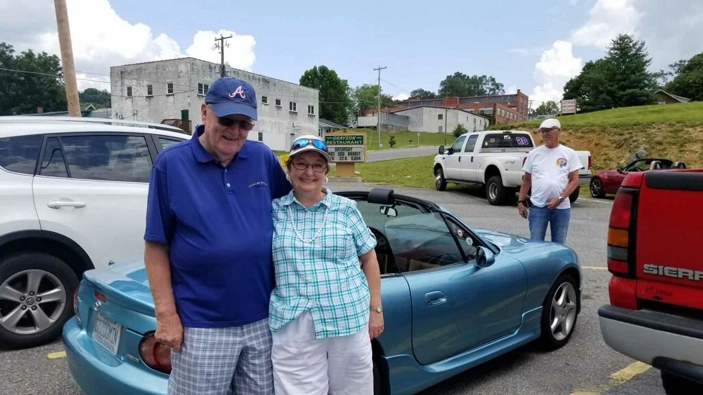 Jim & Cathy with their Miata