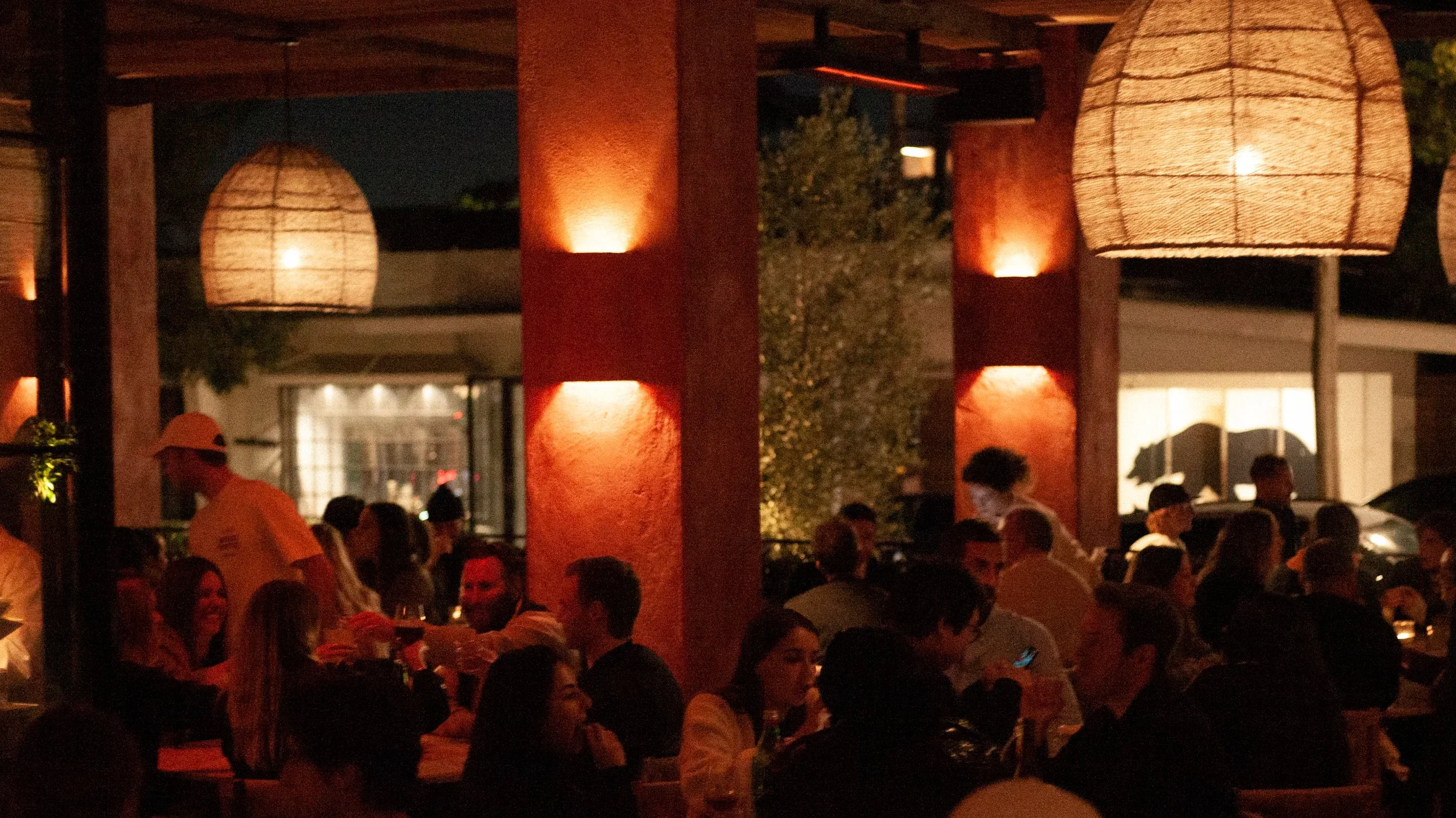 Sun-drenched minimalism. Detailed plaster textures and shadow play capture the "wabi-sabi" design aesthetic of Great White Restaurant Brentwood.
