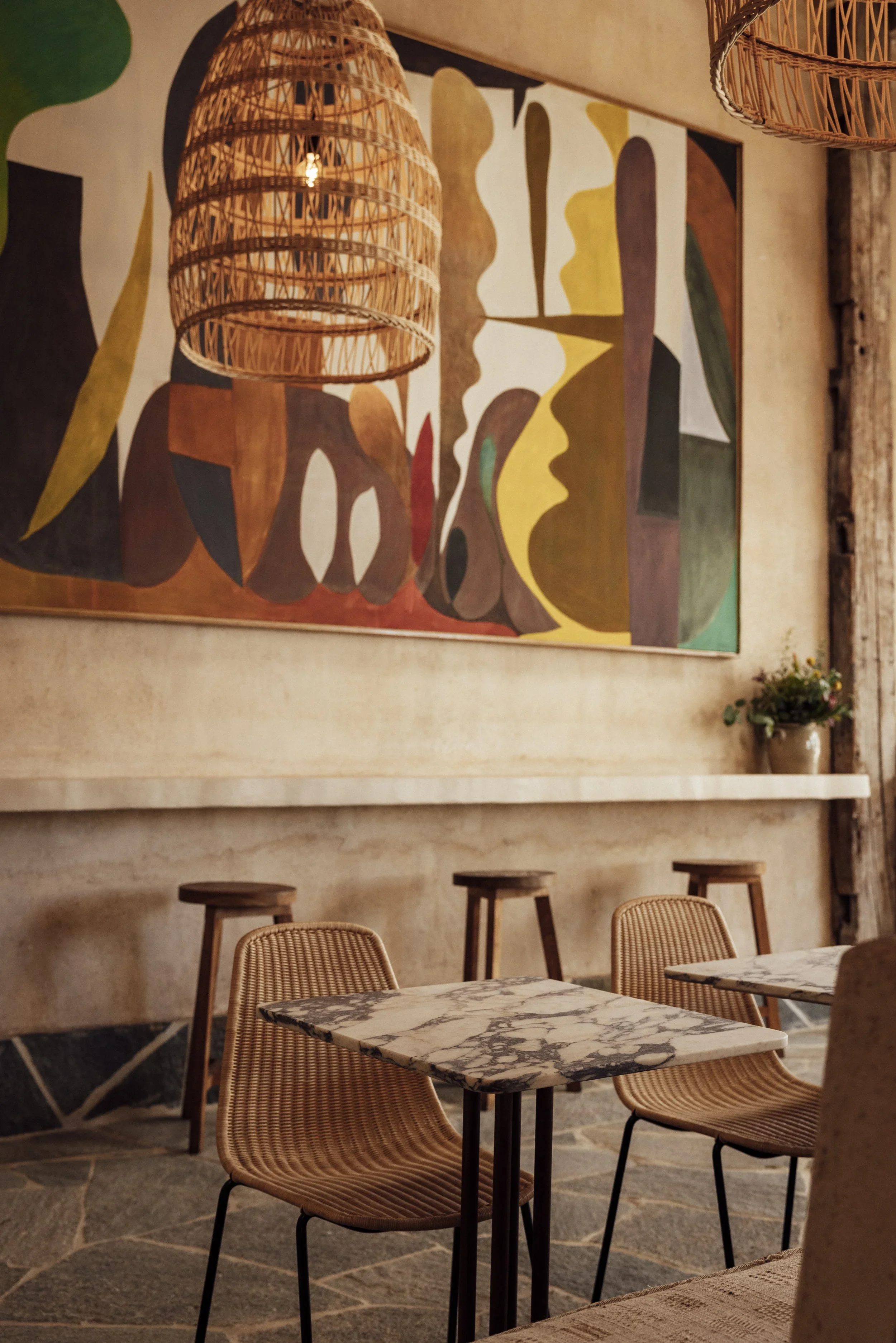 A neighborhood hub. Large-scale abstract murals and rustic stone tables define the main dining room at Great White Restaurant Larchmont Village.