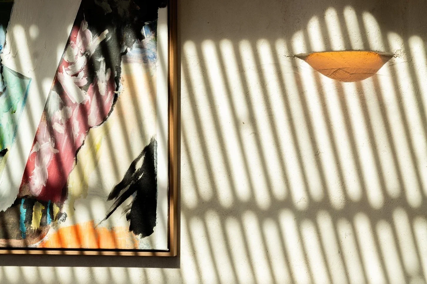 Sun-drenched minimalism. Detailed plaster textures and shadow play capture the "wabi-sabi" design aesthetic of Great White Restaurant Brentwood.