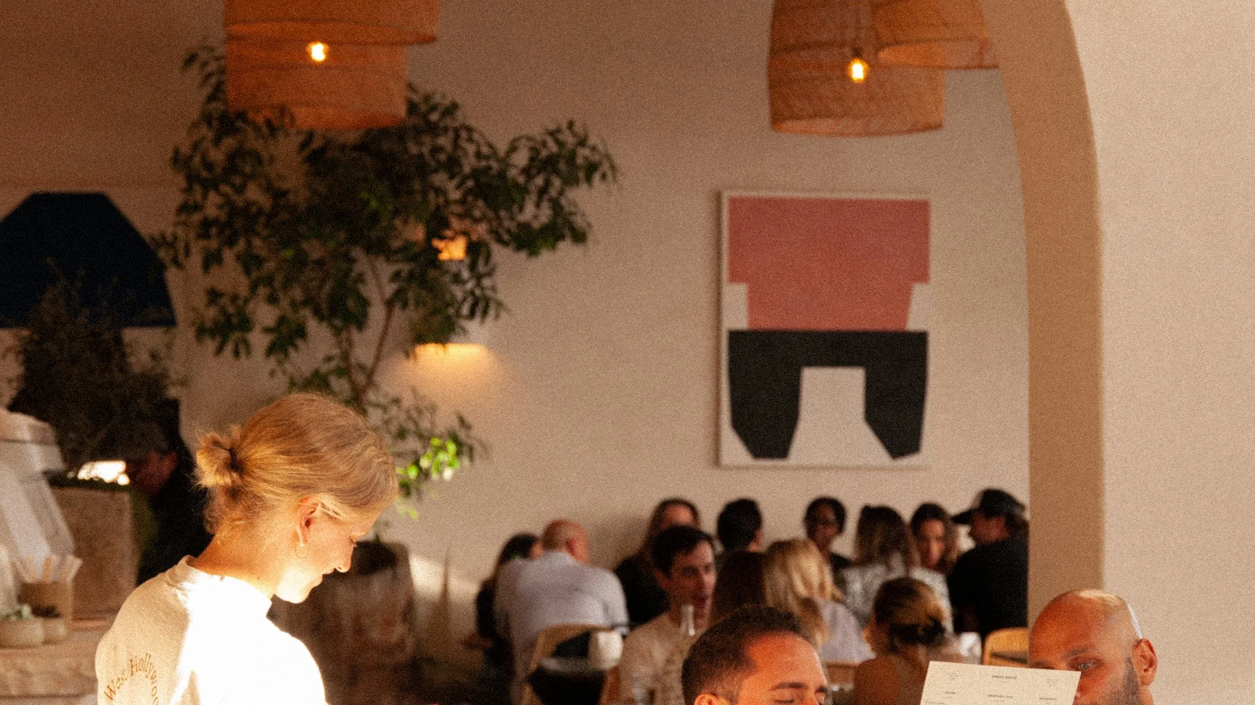 Community and culture. A bustling lunch service bringing locals and creatives together at Great White Restaurant West Hollywood.