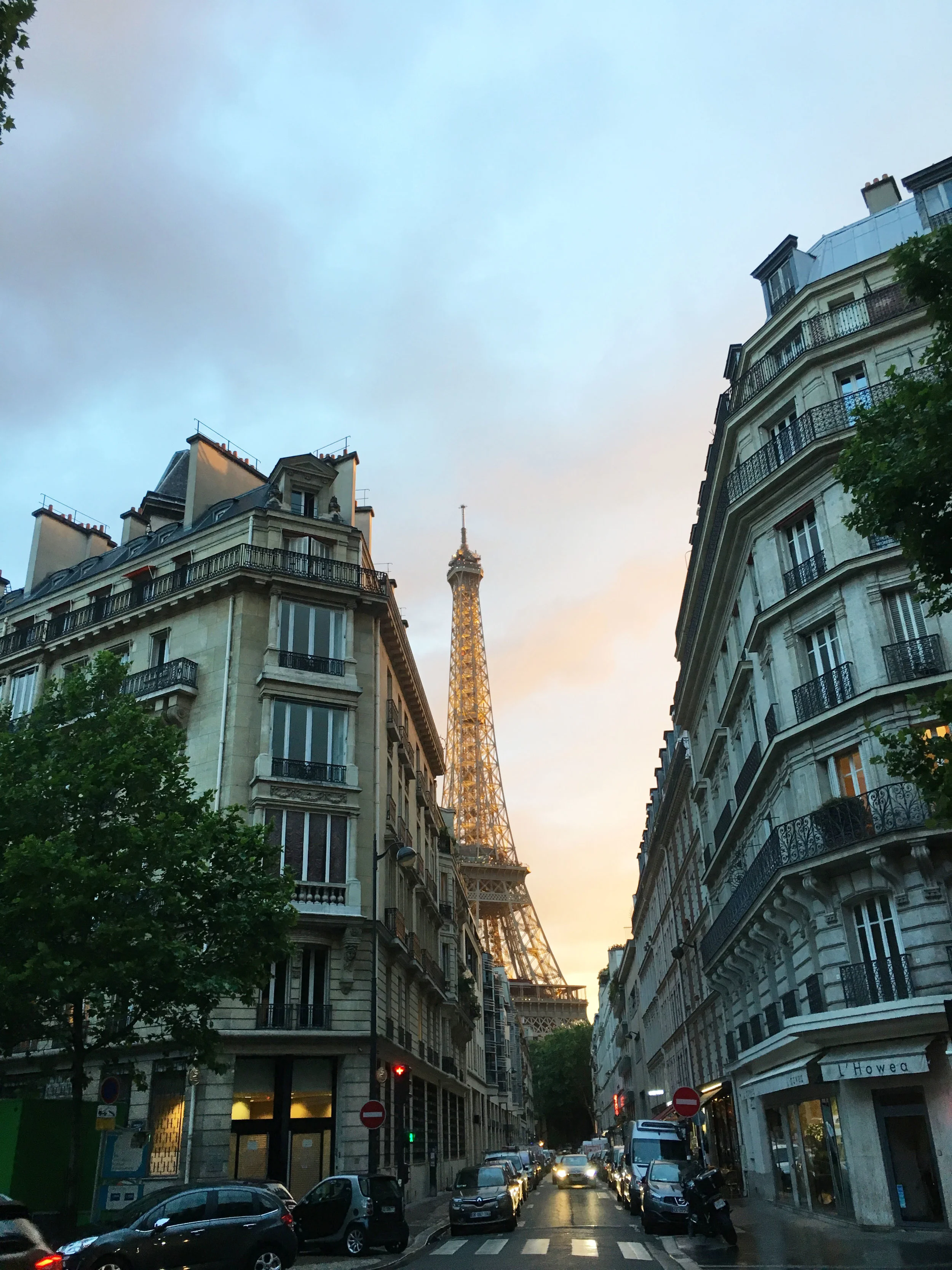 Just after sunset, the 984-foot Eiffel Tower glows.