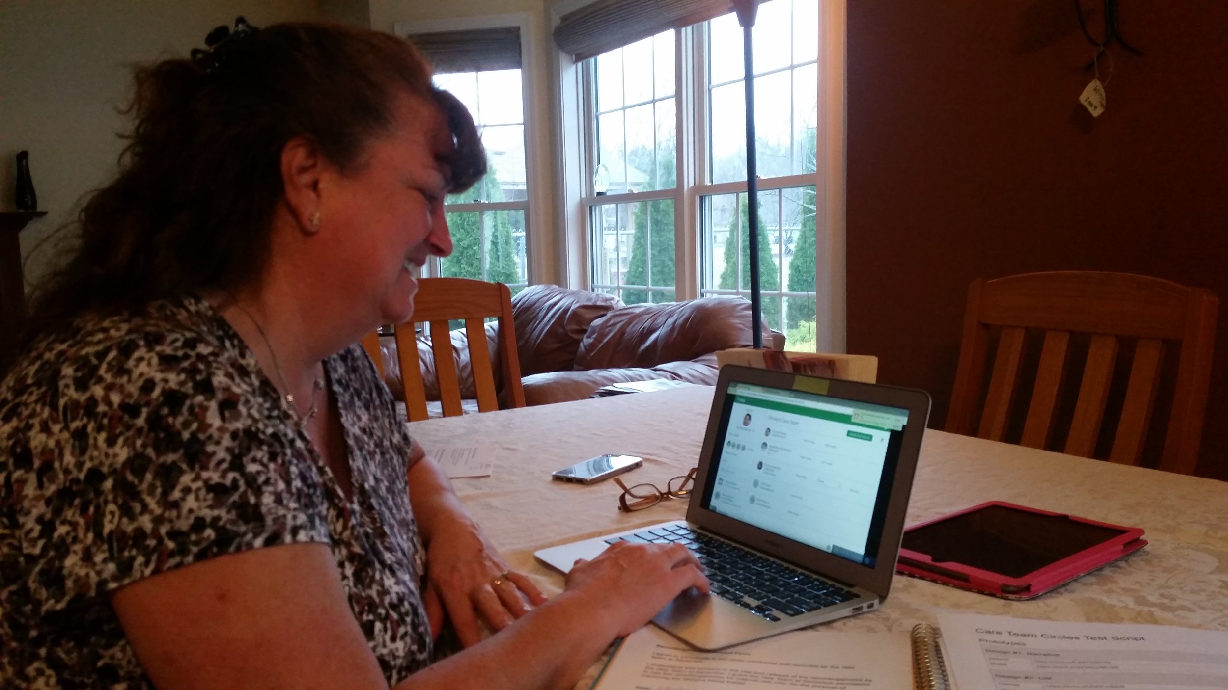  This caregiver takes care of her mother-in-law and uses Vela on her laptop. 