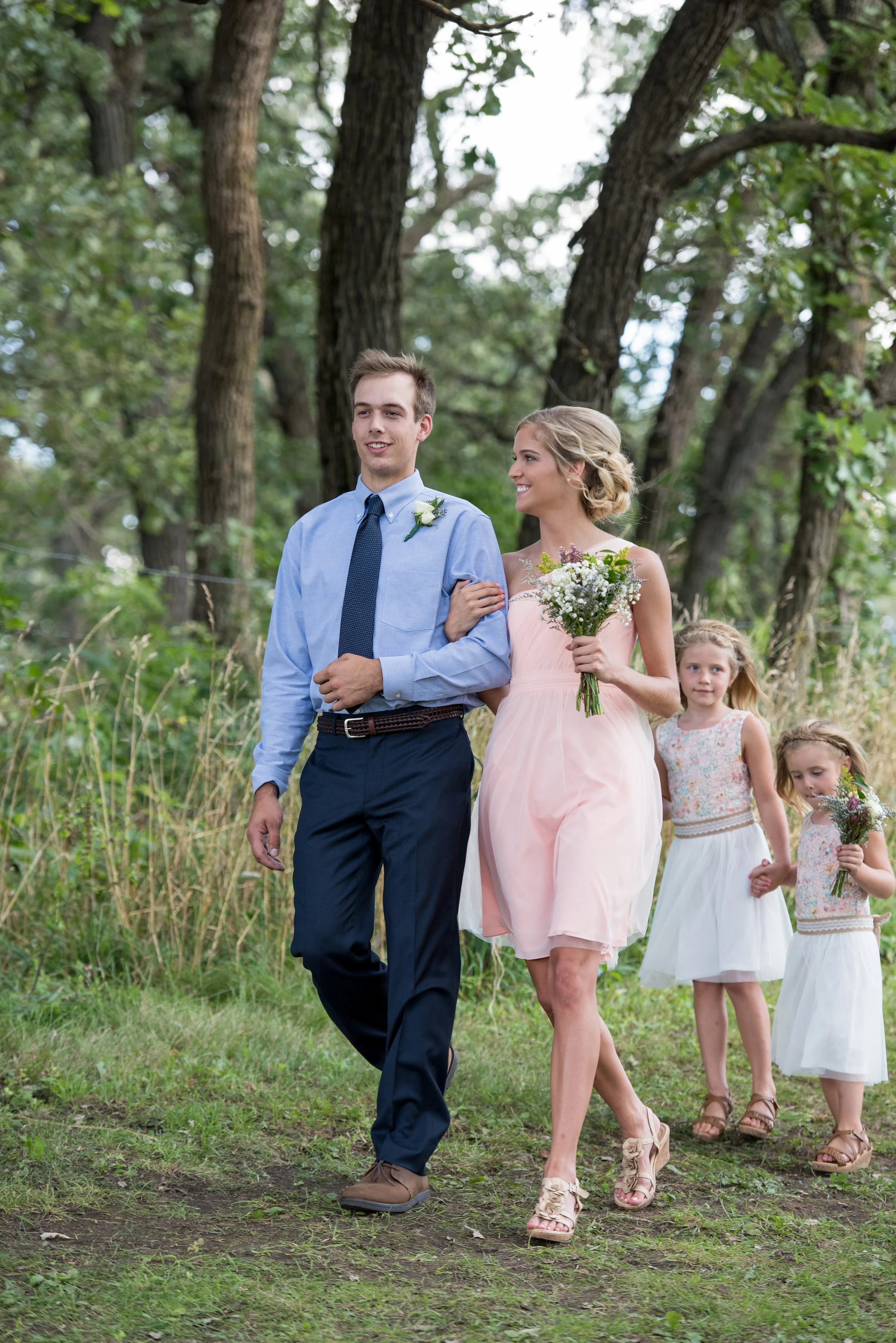 The Best Man and Maid of Honor...with flower girls close behind.