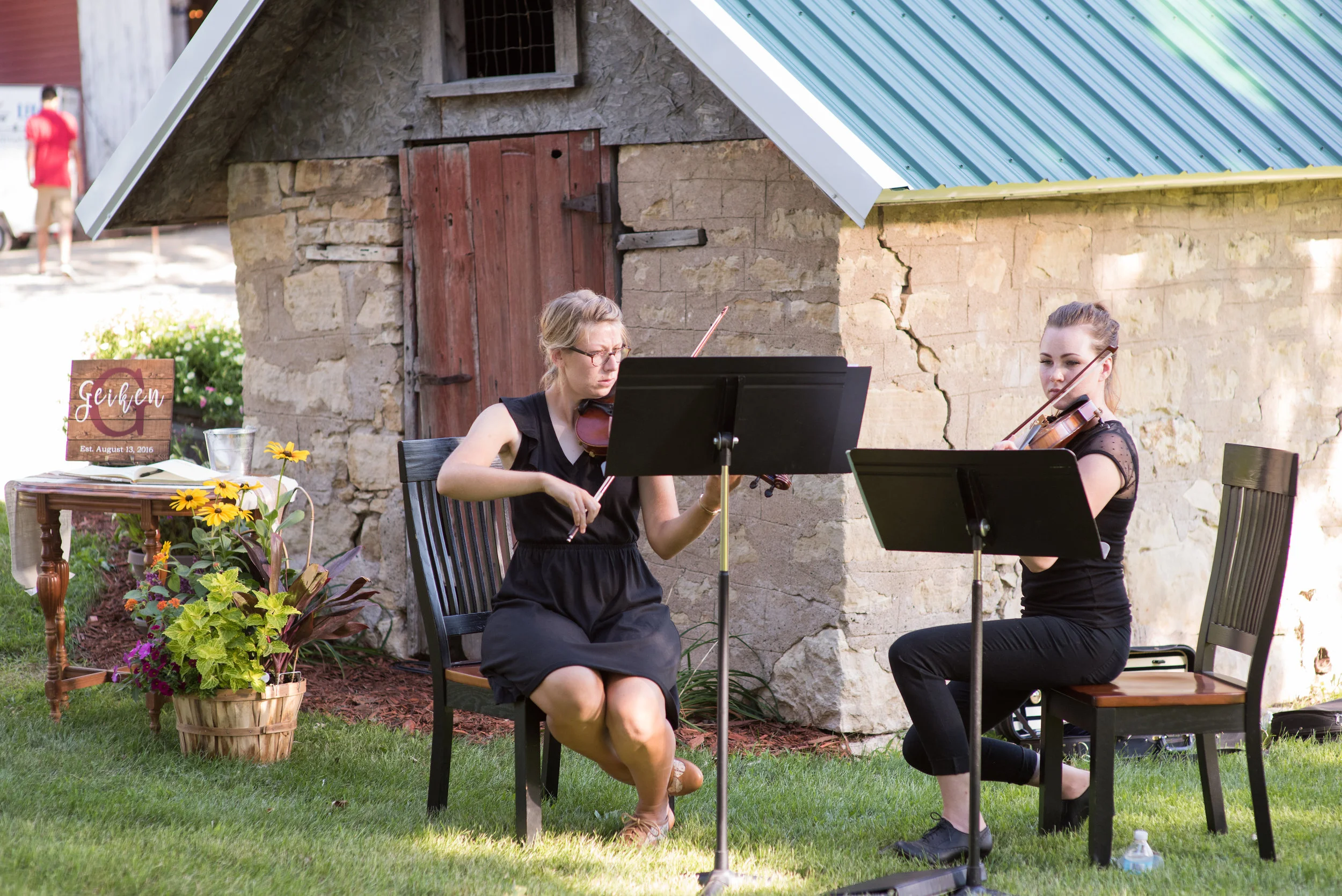 Musicians posted by the guest book set the mood and welcome guests as they arrive.