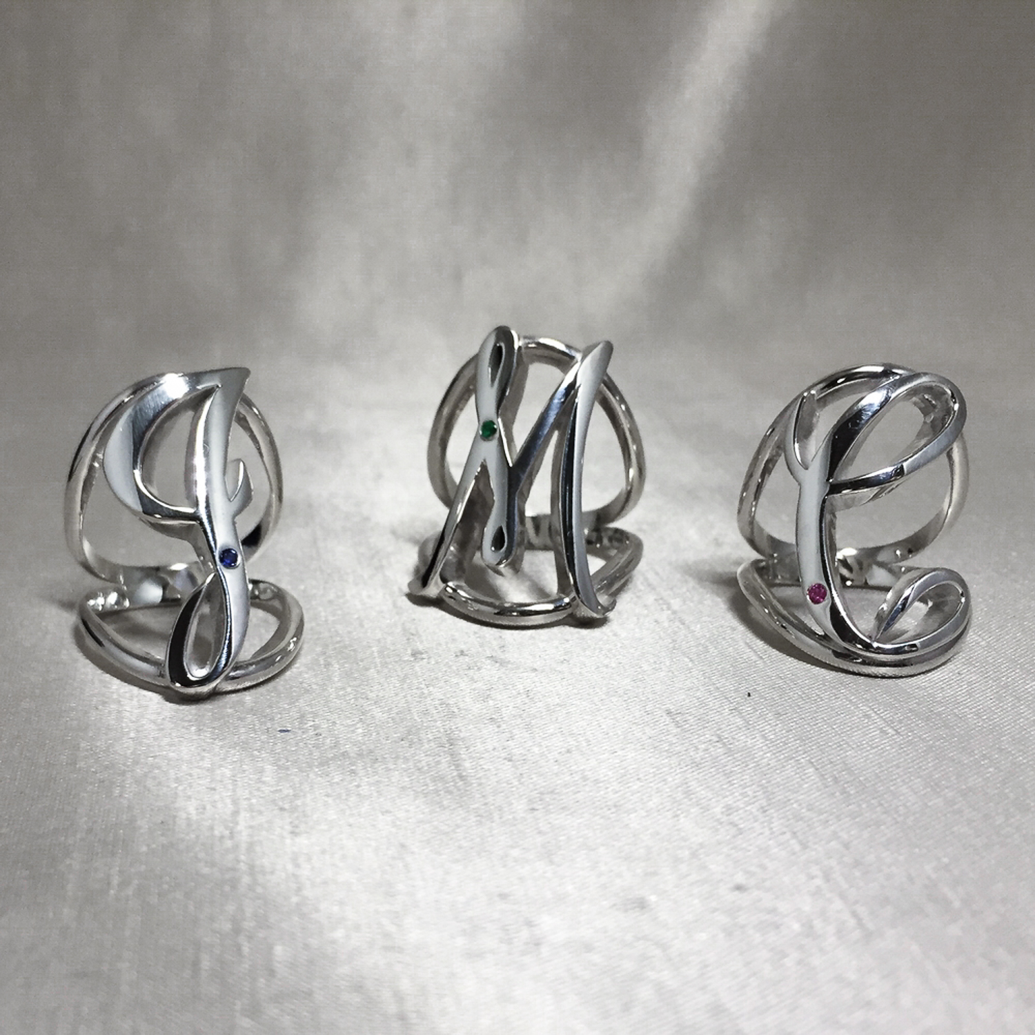   Custom Initial Rings with Birthstone Gems.  