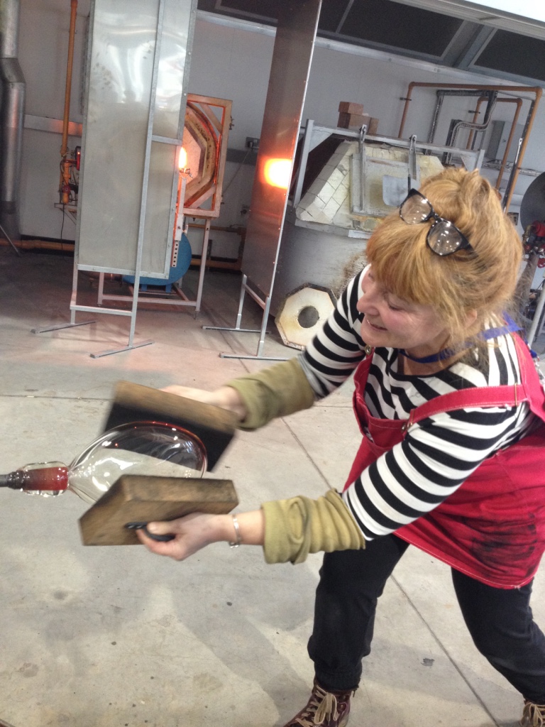 after a fair bit of prototyping, Lawrence then brought me in to shape the hot glass. These cork pads kept bursting into flames as I shaped, since I didn't move them in quick enough circles over the face of the glass, but Lawrence is endlessly patient with my efforts....