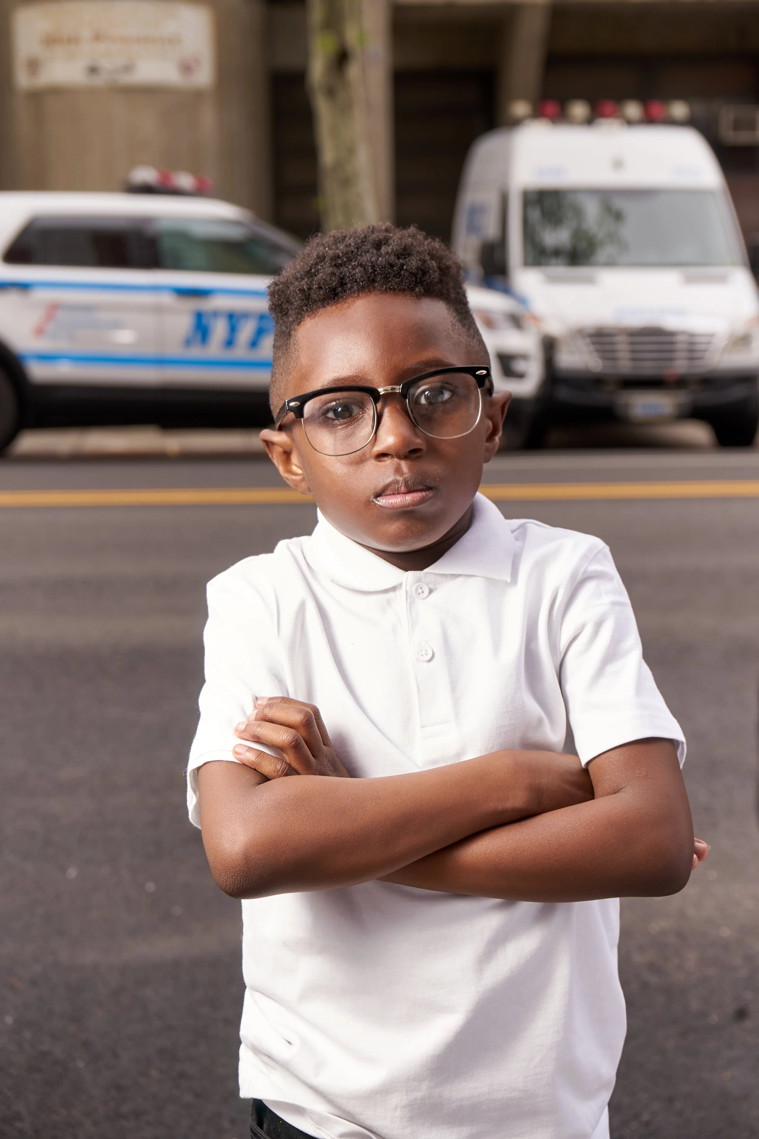 Corey standing in front of the NYPD's 28th Precint in Harlem. The site where Malcolm X rallied a few hundred protesters to march and petition for the release of a man police took into custody and denied medical attention.
