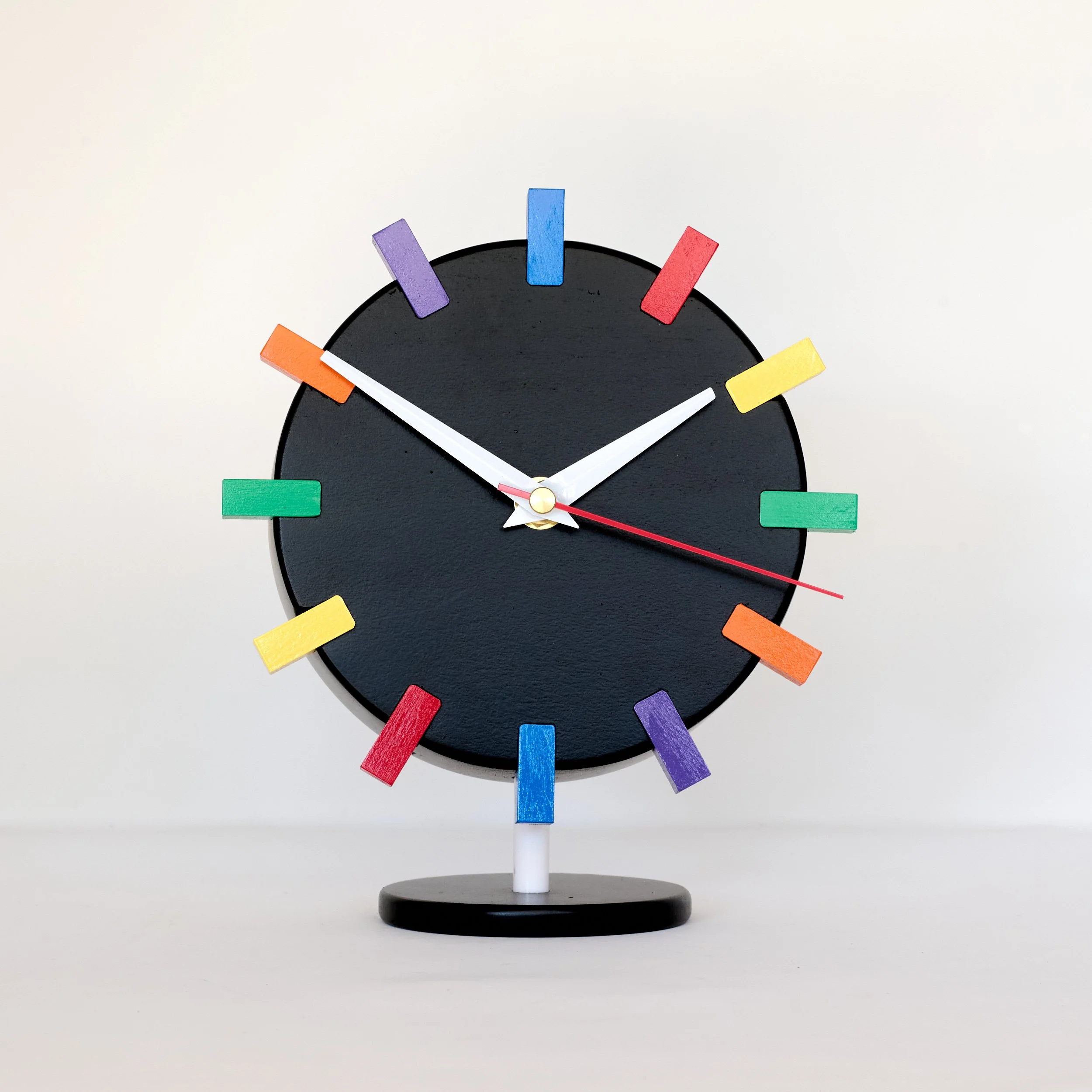 Black lacquer rainbow clock with mid-century design
