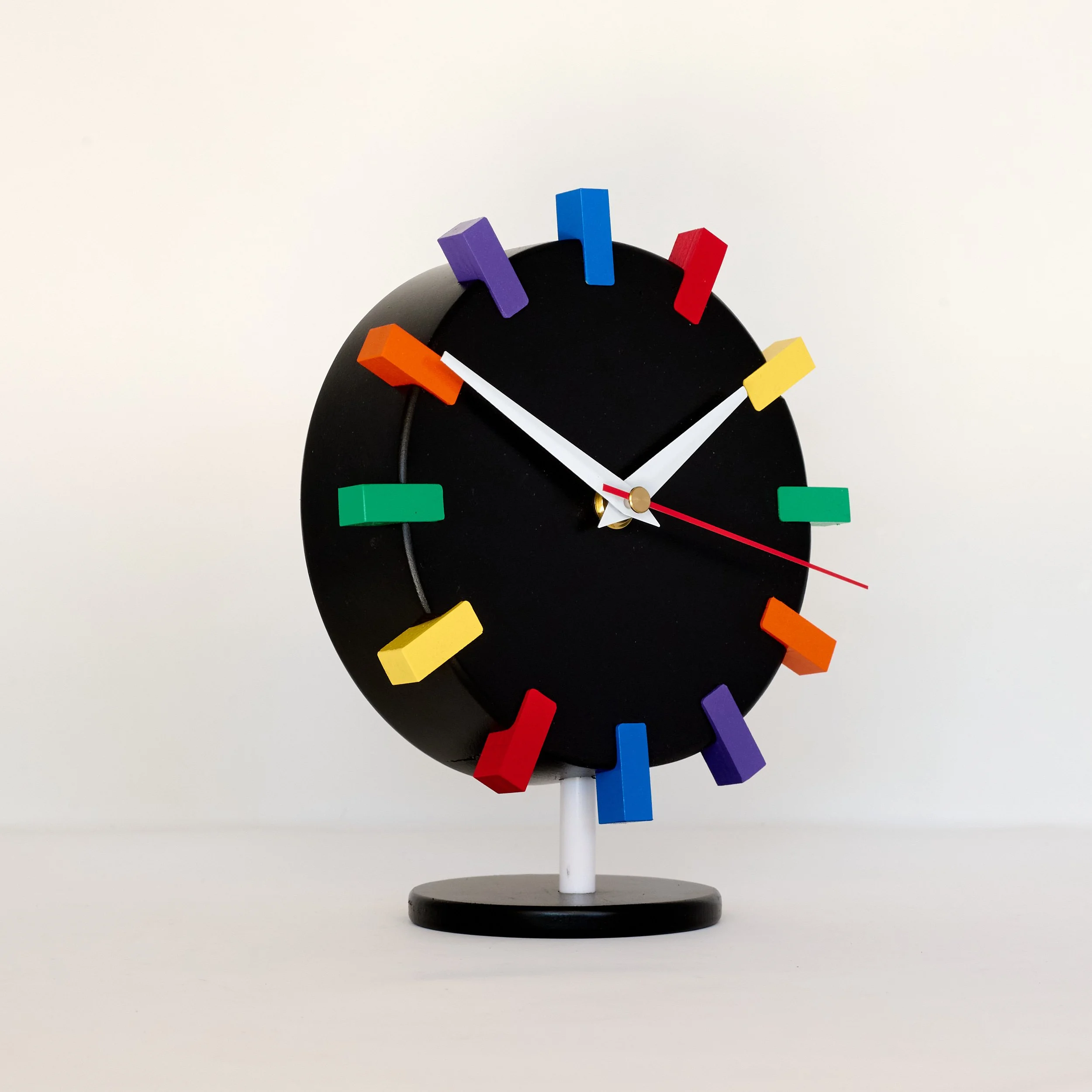 Black lacquer rainbow clock with mid-century design