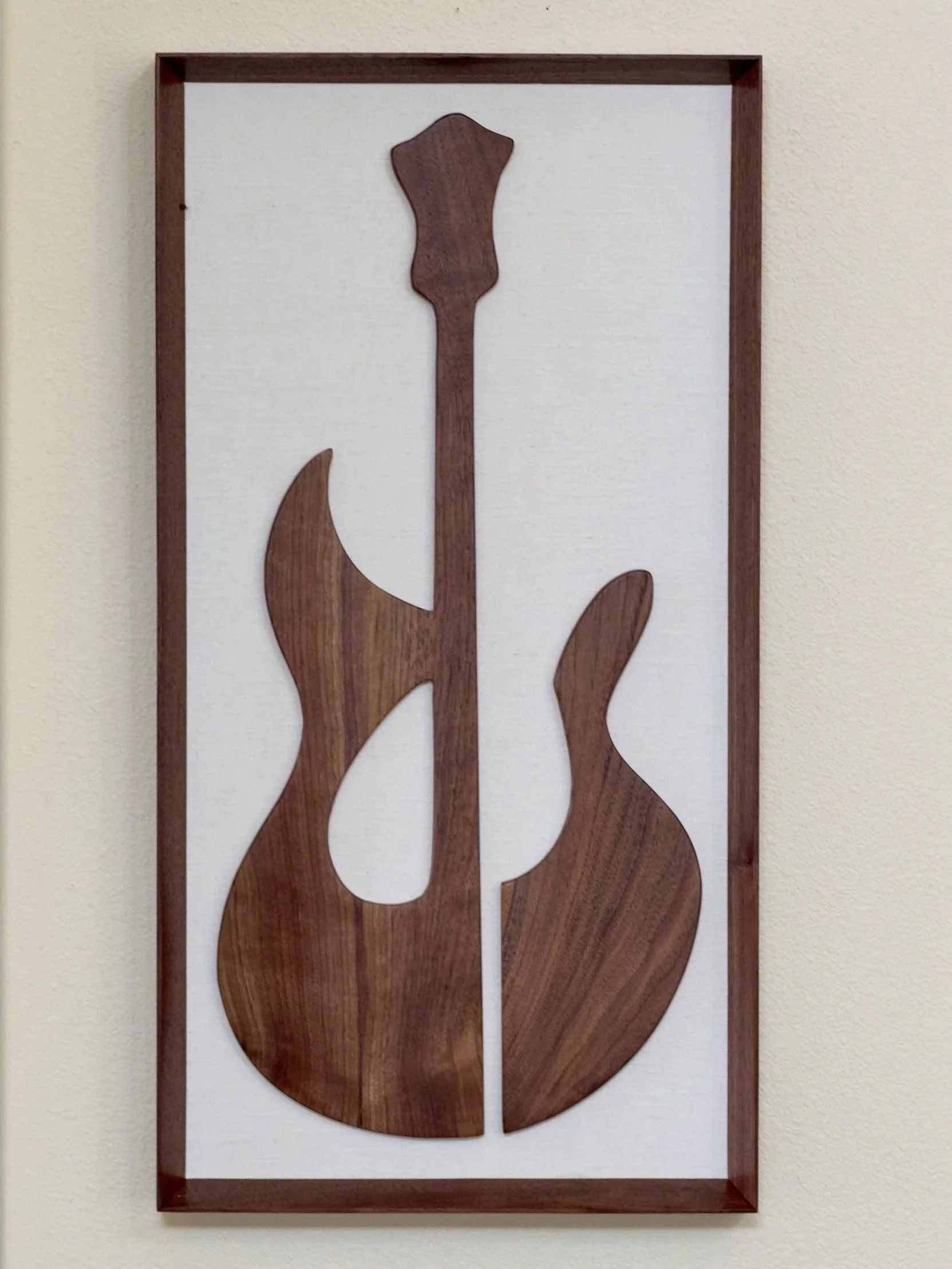 Abstract walnut guitar wall sculpture in portrait orientation