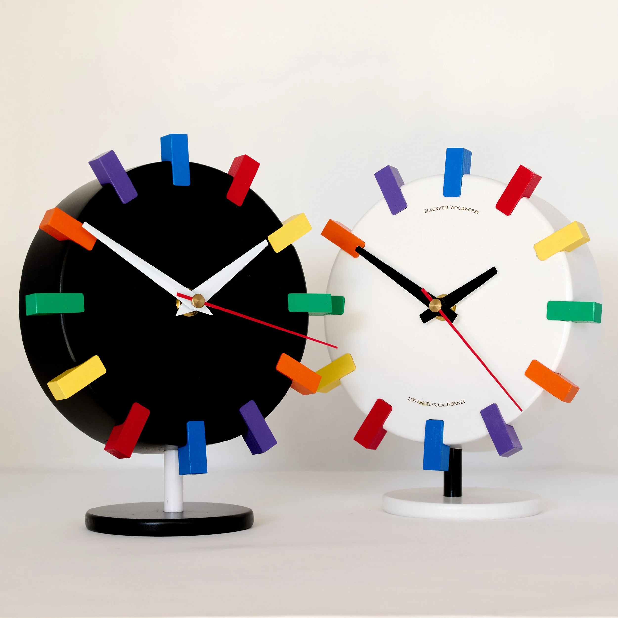 Modern wood desk clock with colorful hour markers by Eric Blackwell
