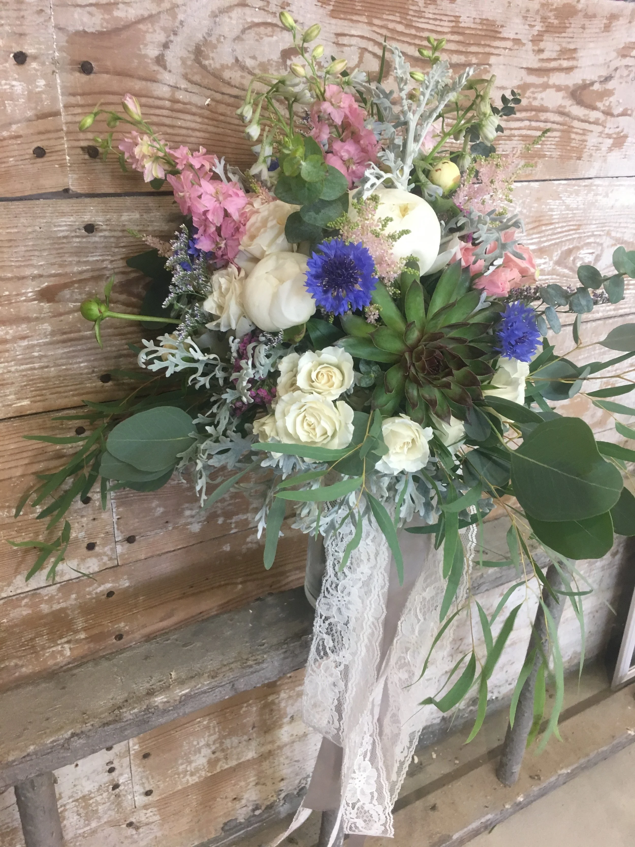 Every boho bride needs wildflowers, succulents, and lace ribbon!!