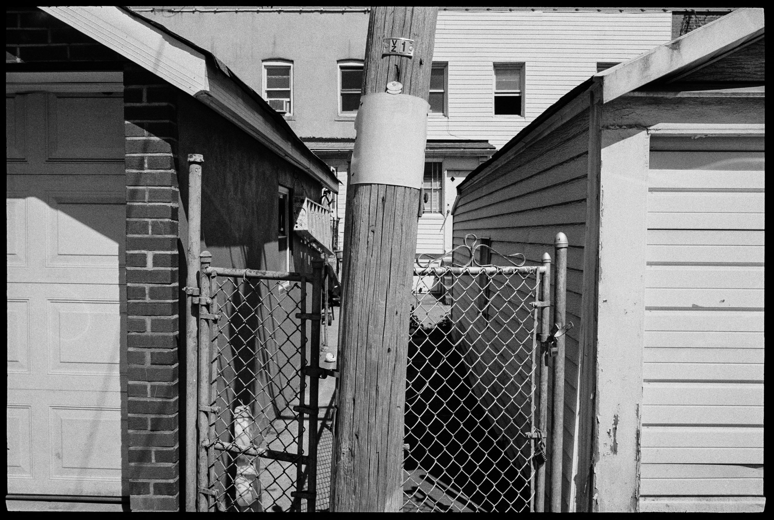 5.25.23-2 queens ally poles and garages2 001 copy.jpg