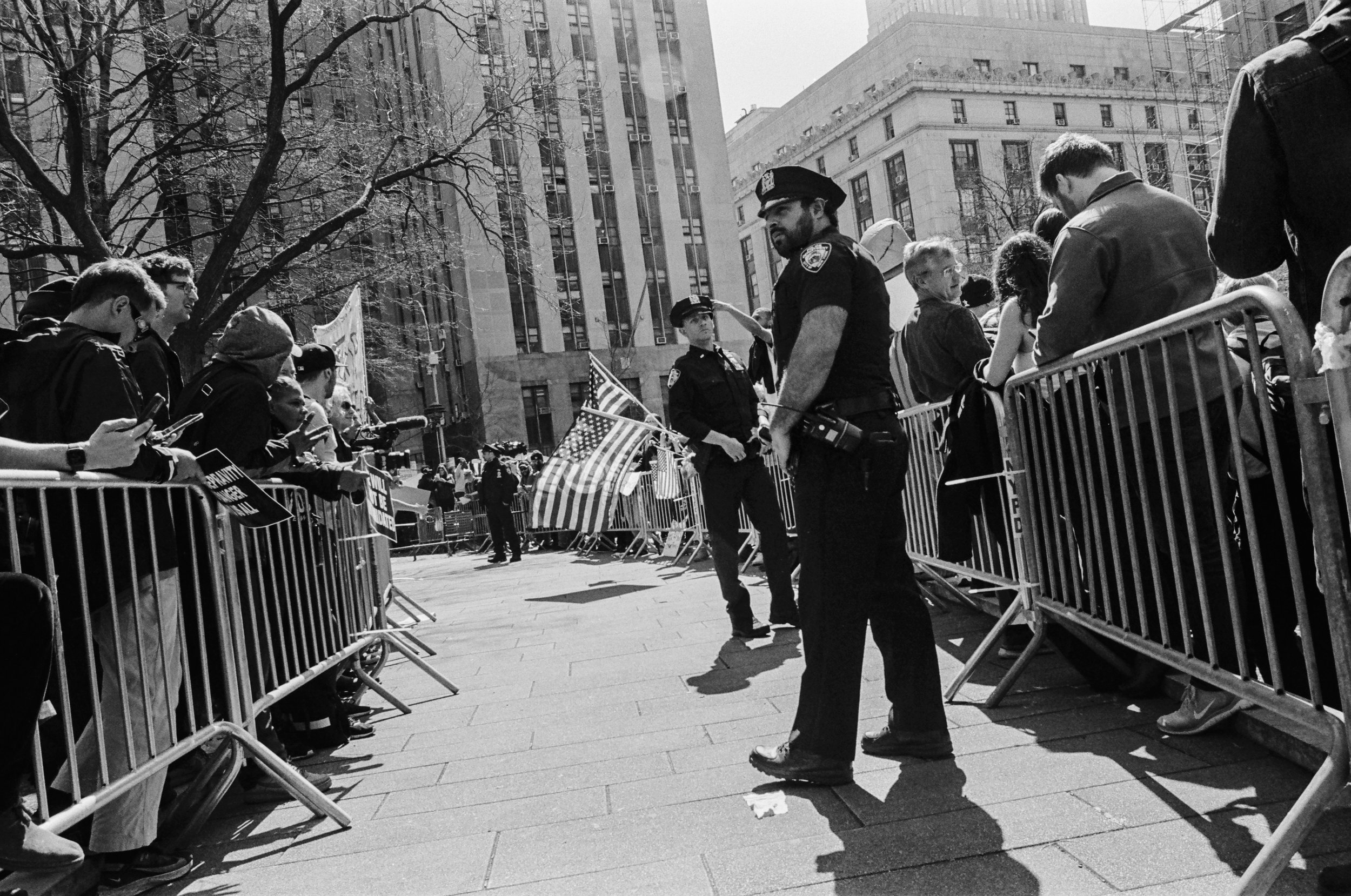 cops in between barricades separating pro and anti trumpers
