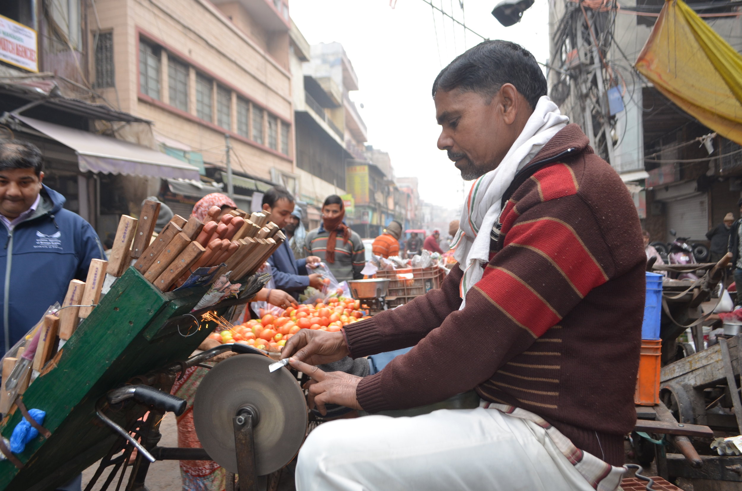Old Delhi Market  knife sharpening Beacon Holidays India Tours