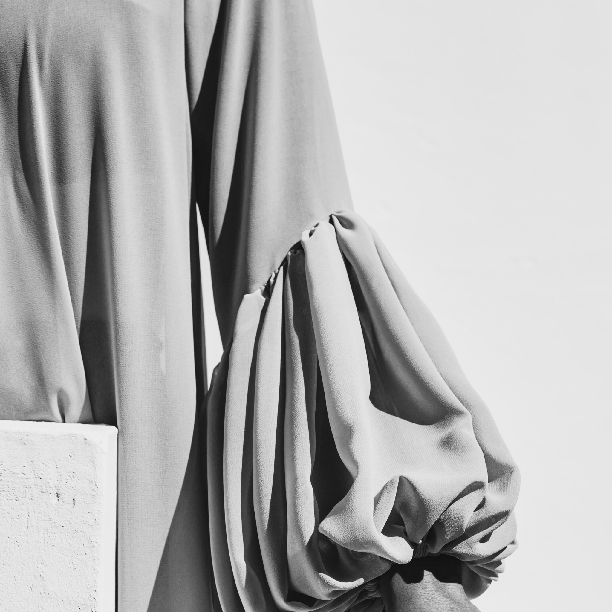 Close-up of a puff sleeve fabric on a wall.