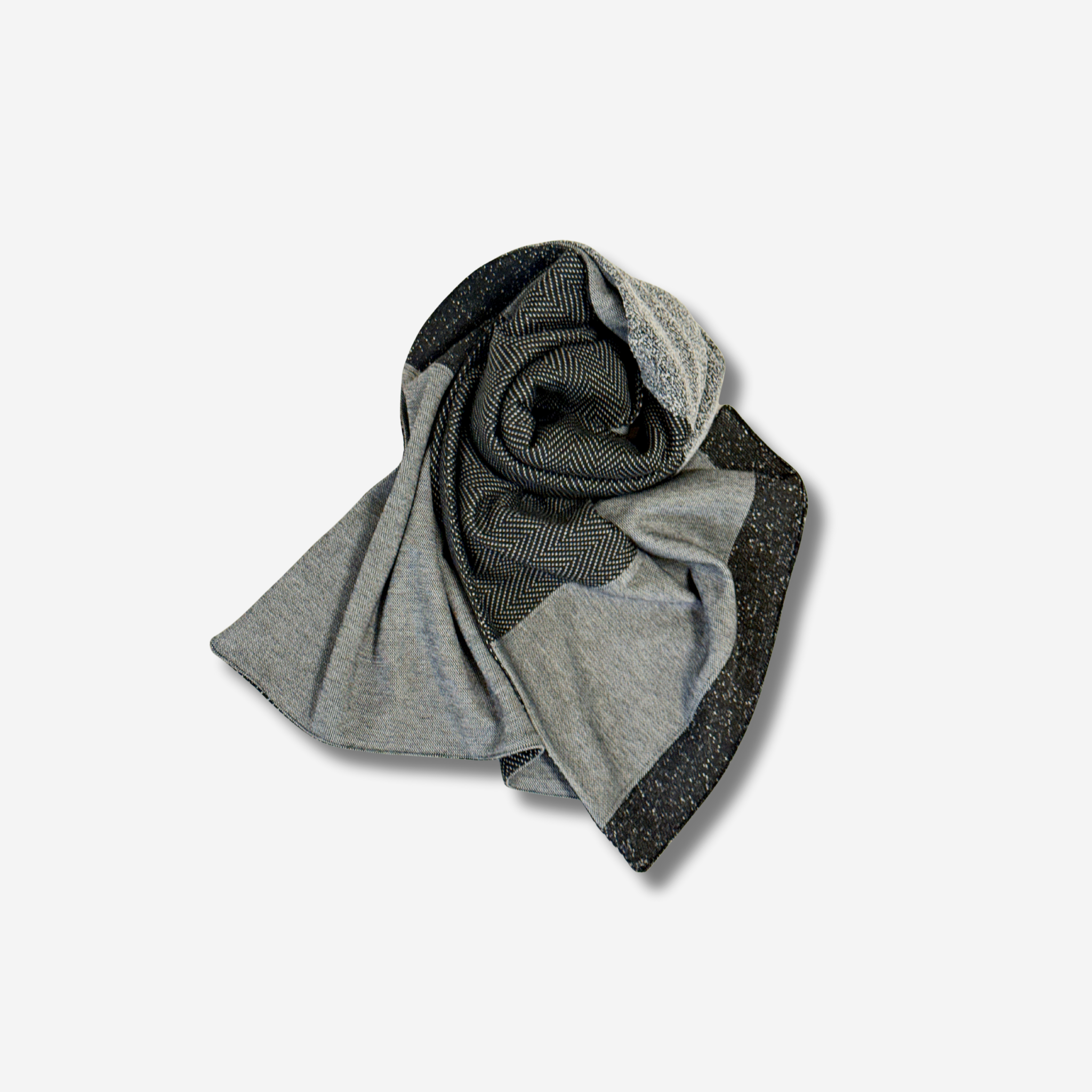 Gray and black patterned scarf folded and laying on a white background.