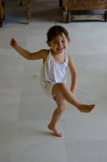 H, at 3. The music moves through her. 