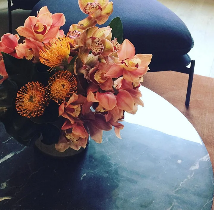 We often use orchids in our weekly flower designs - they come in a range of great colors and are long lasting.