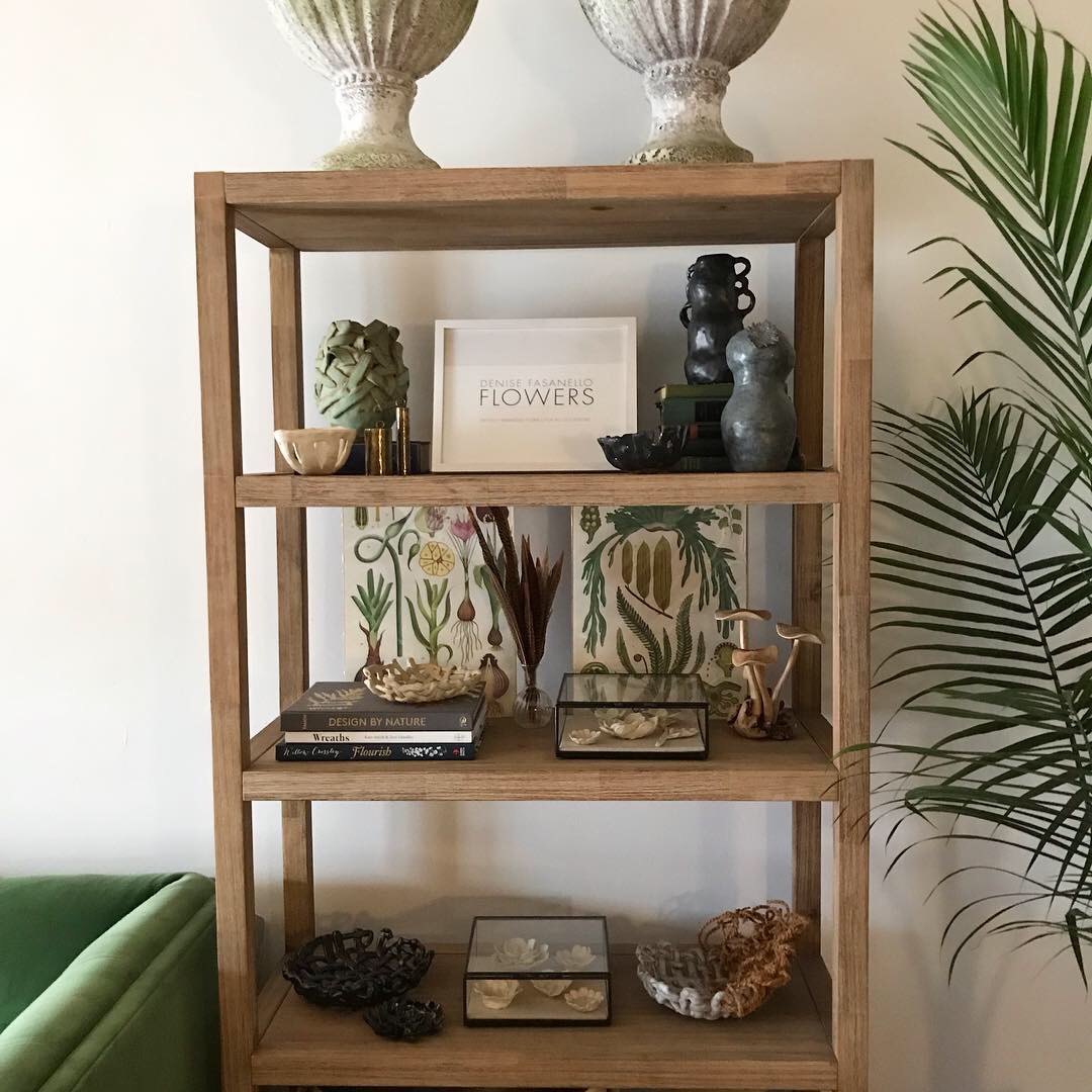 Display shelf holding some of my handmade ceramics and current favorite design books