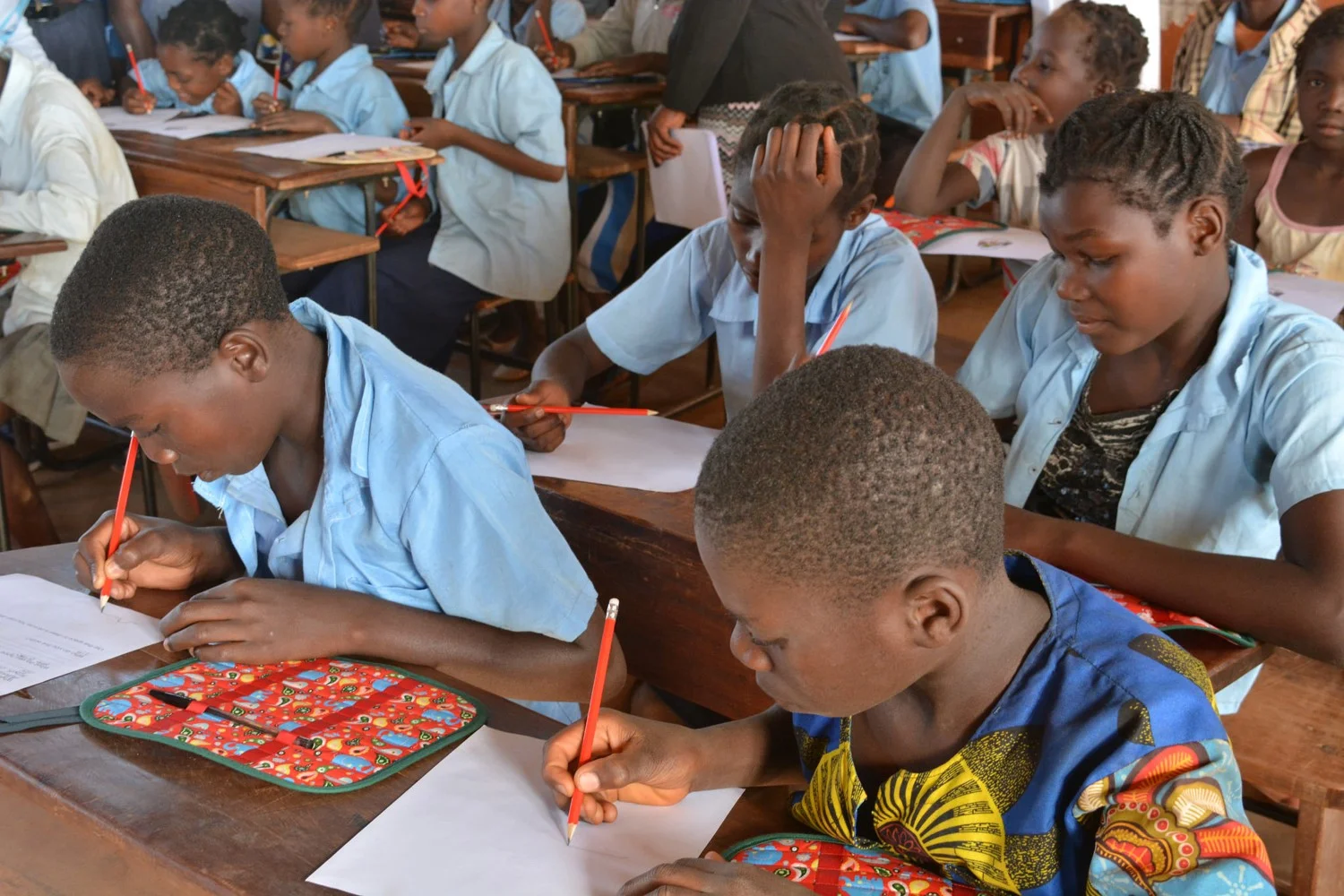 A photo of children in Mozambique working at school