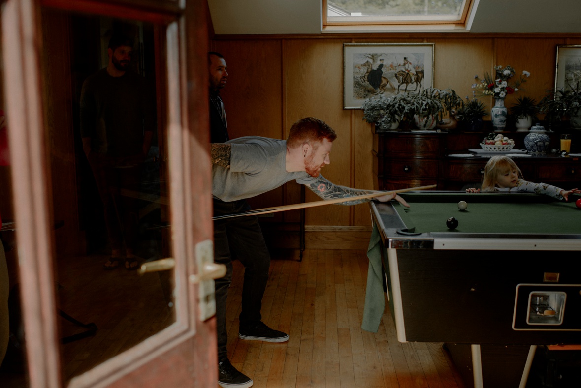 man is playing pool