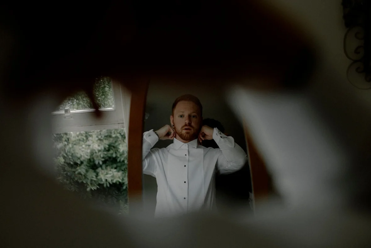 groom in mirror
