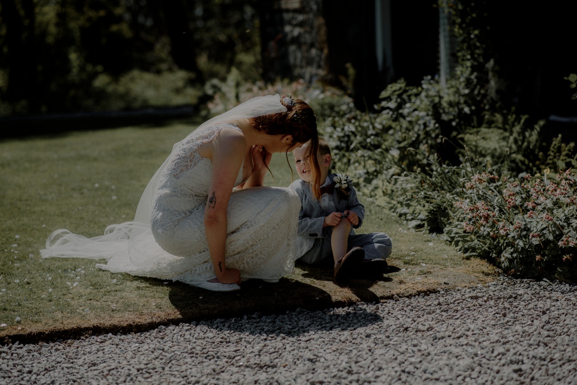 bride is chatting to a little boy