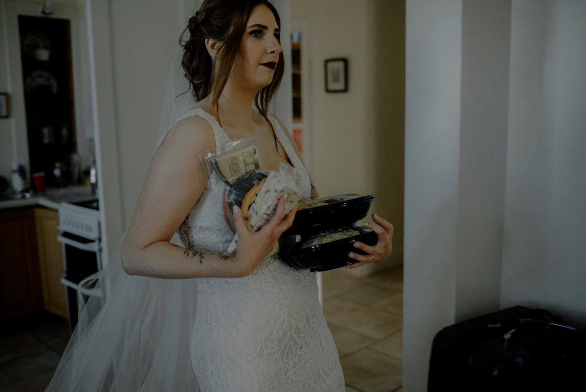 bride is carrying cheese in her hands