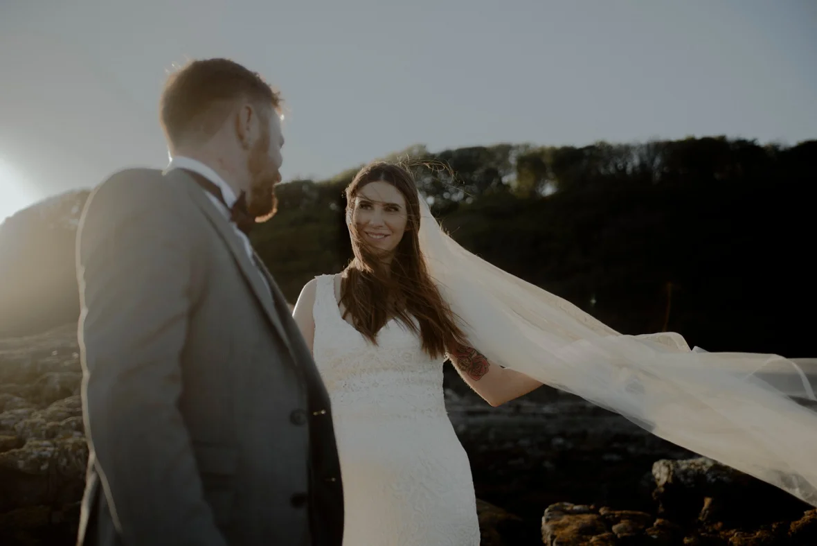 bride is lovingly looking at her groom