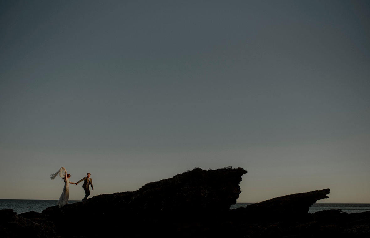 married couple on cliff