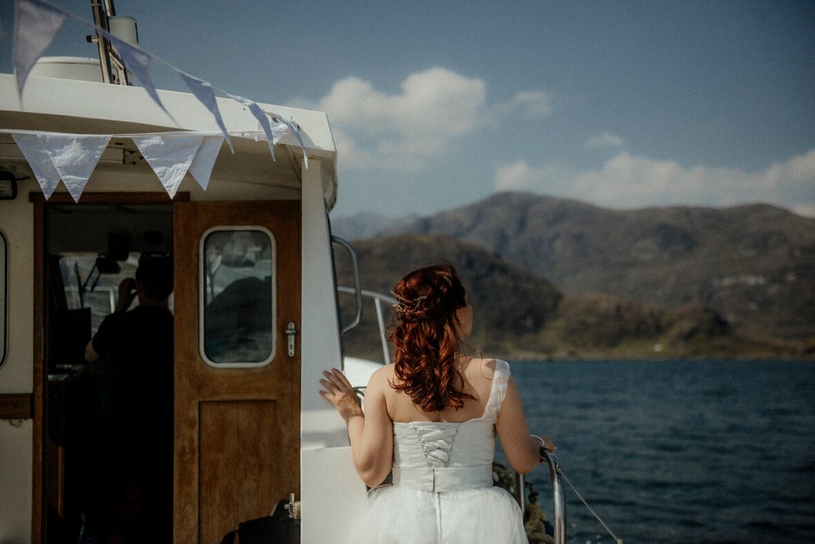 bride is admiring the view on the beautiful Isle of Skye