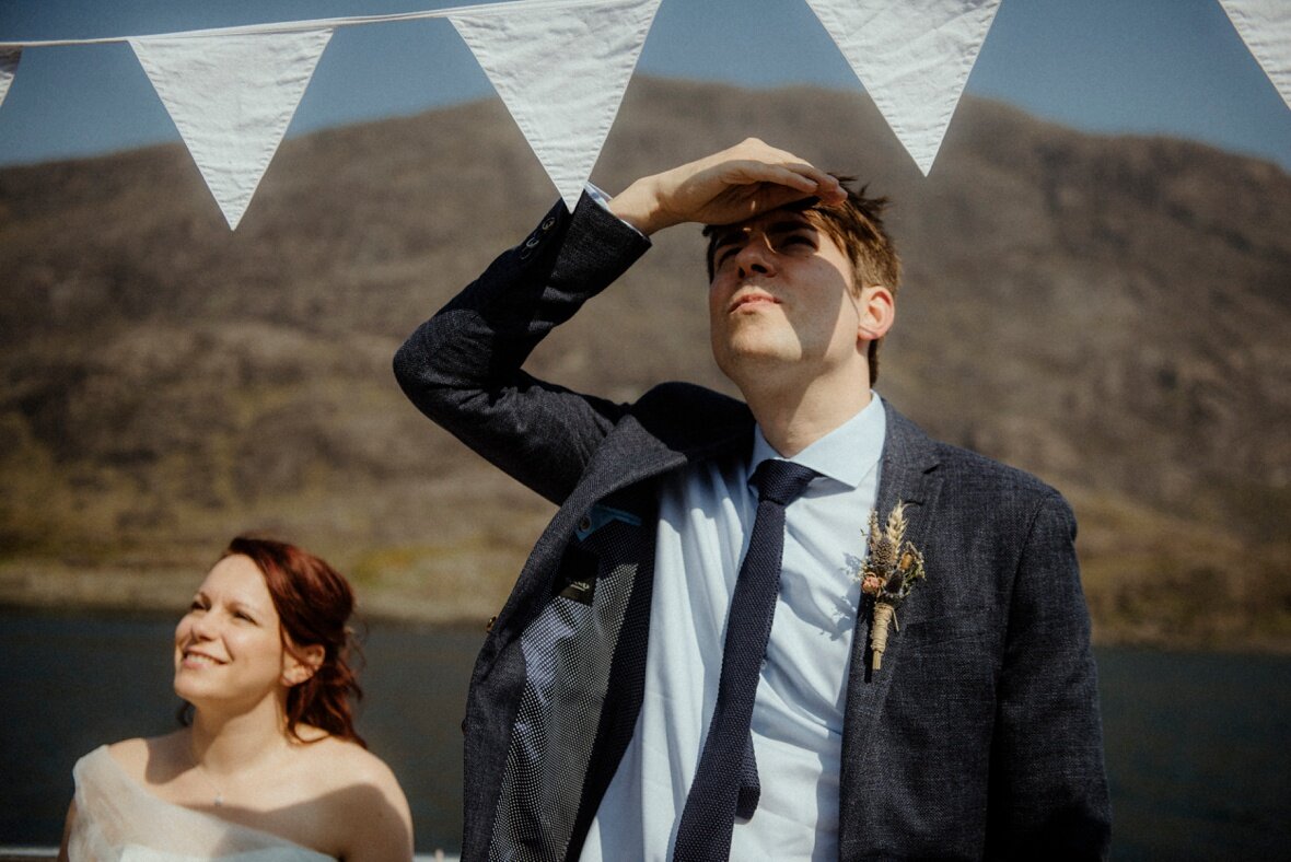 bride and groom on boat on Isle of Skye