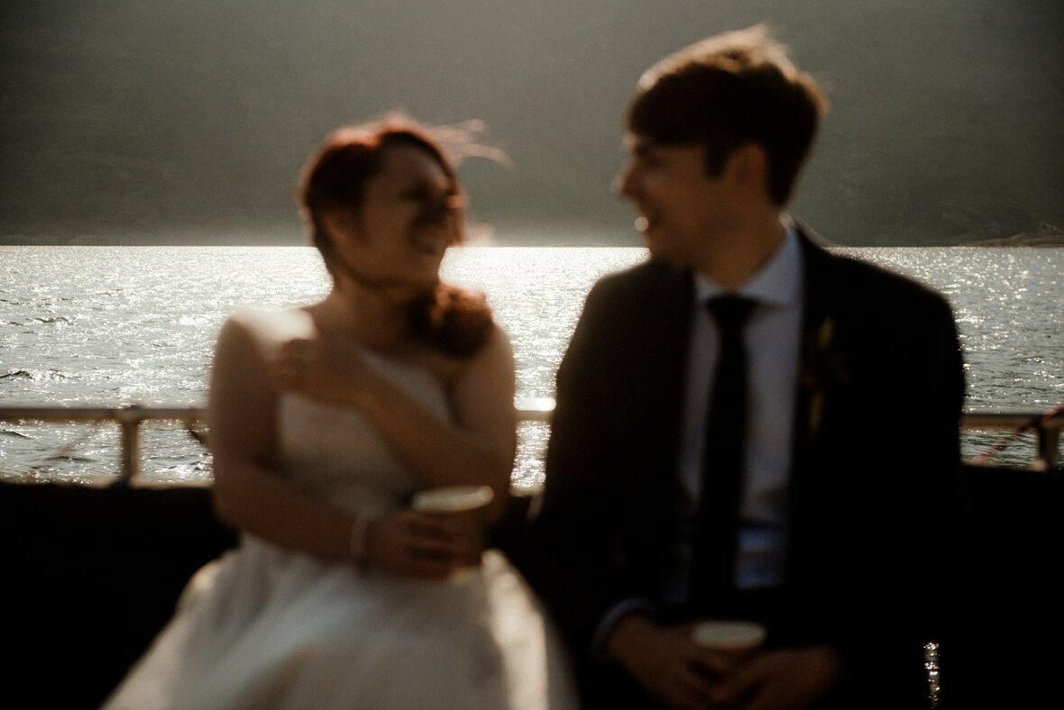 happy bride and groom during their boat trip in Scotland