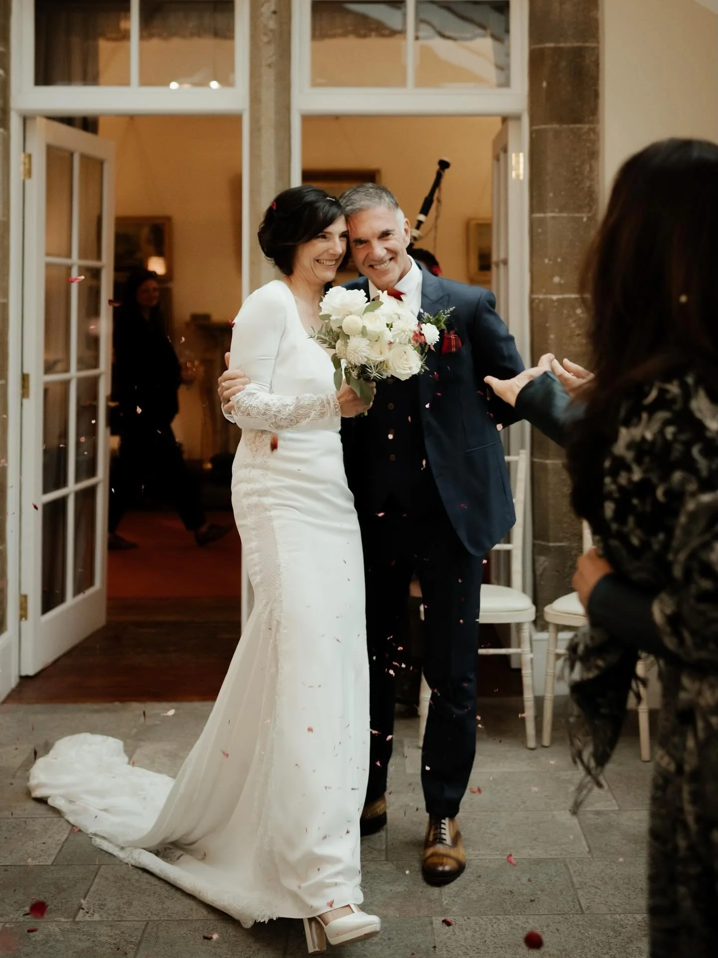 Not a ray of sunshine in sight, yet somehow it felt like midsummer. Nathalie &amp; Bruno&rsquo;s wedding was a masterclass in how to make your own weather &mdash; laughter forecast: 100%. 
The warmth was all in the people, in the hugs, the dancing, t