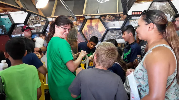 Jacque at the bee booth.jpg