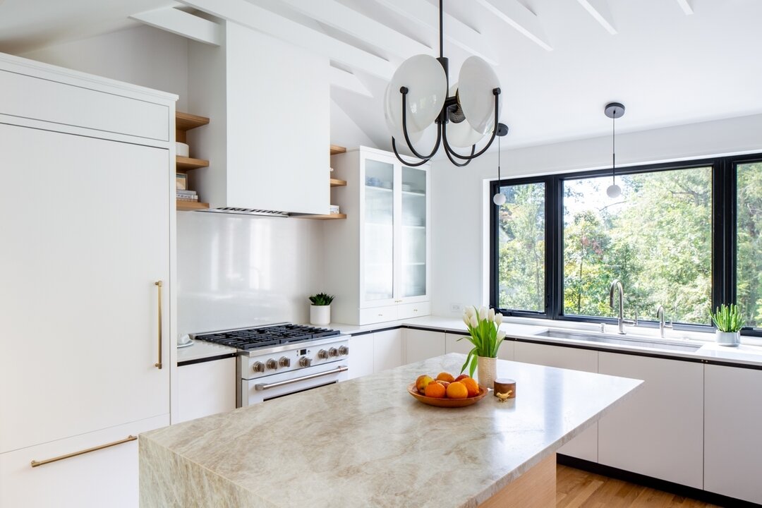 We love a good before and after. The original kitchen at our Rugby project, added a few decades ago, had low ceilings, a tiny window overlooking the expansive back yard, and dated...everything. We took advantage of attic space to vault the ceiling an