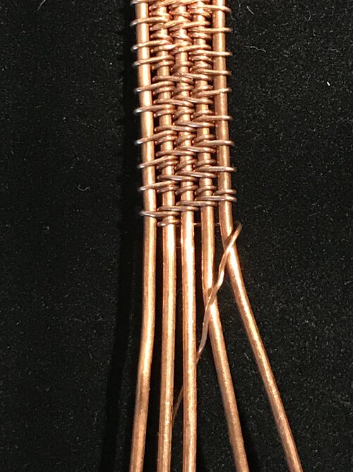 Weaving with copper wire on weaving sticks