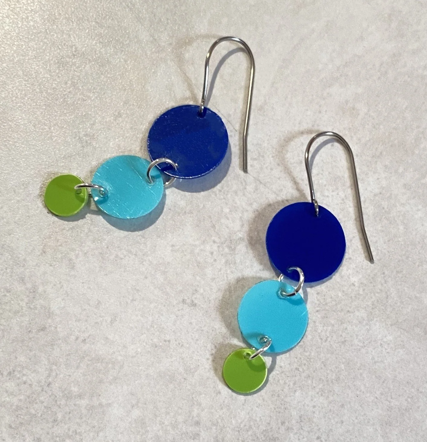 Swingy drop earrings blue and green recycled plastic earrings have a retro style