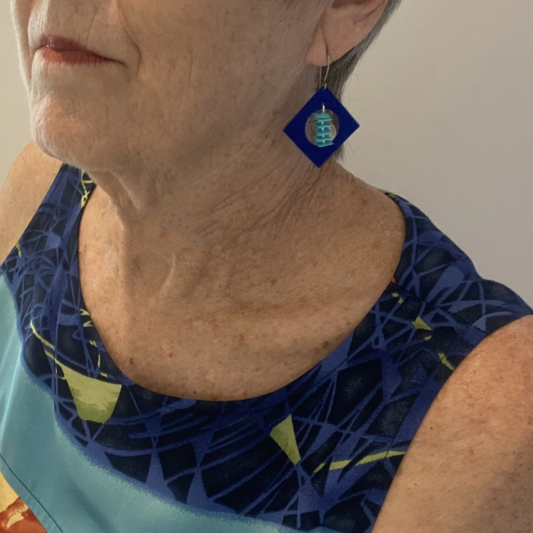 Wearing your blue earrings with a zig zag dangle