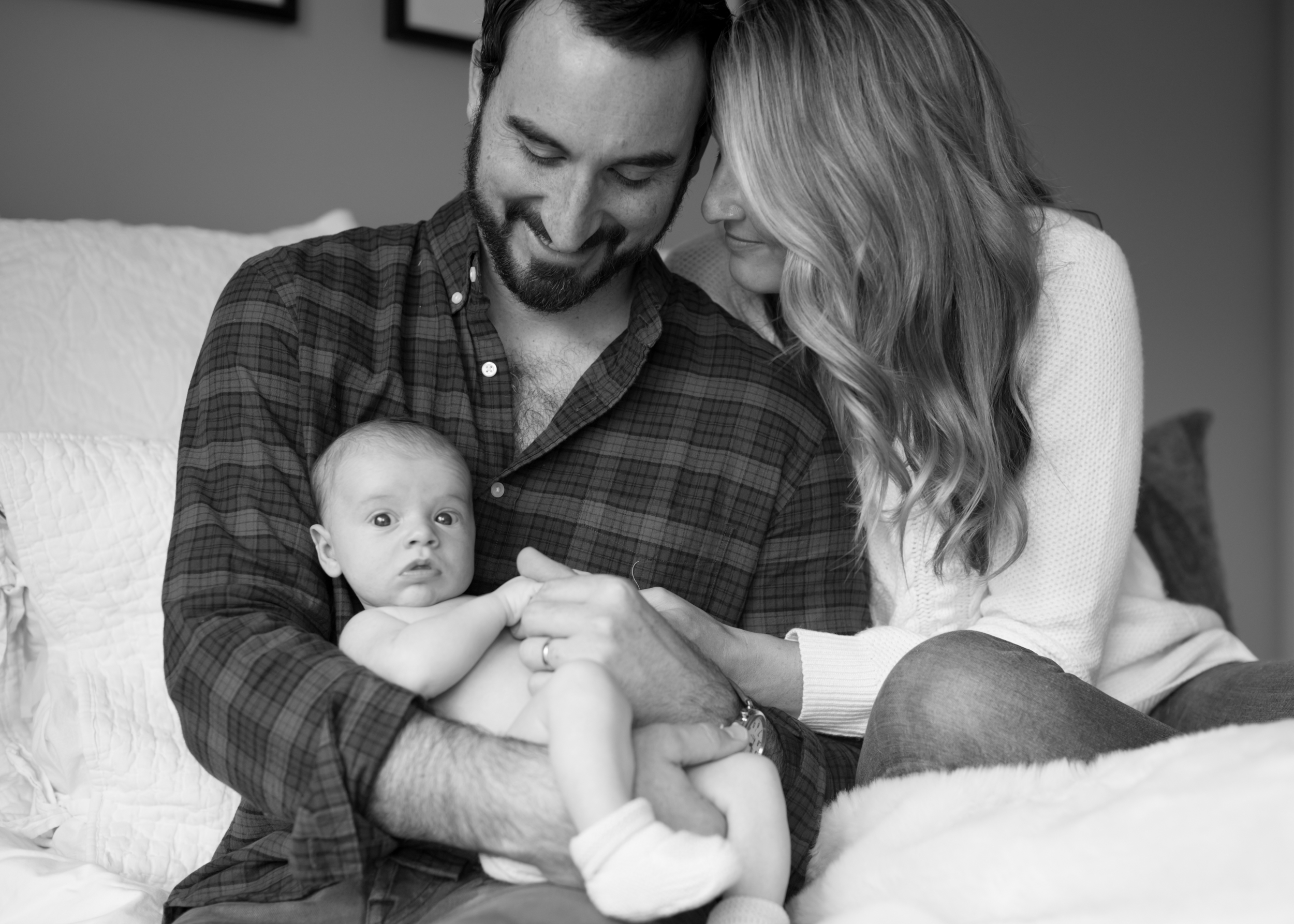 Parents adoring newborn baby