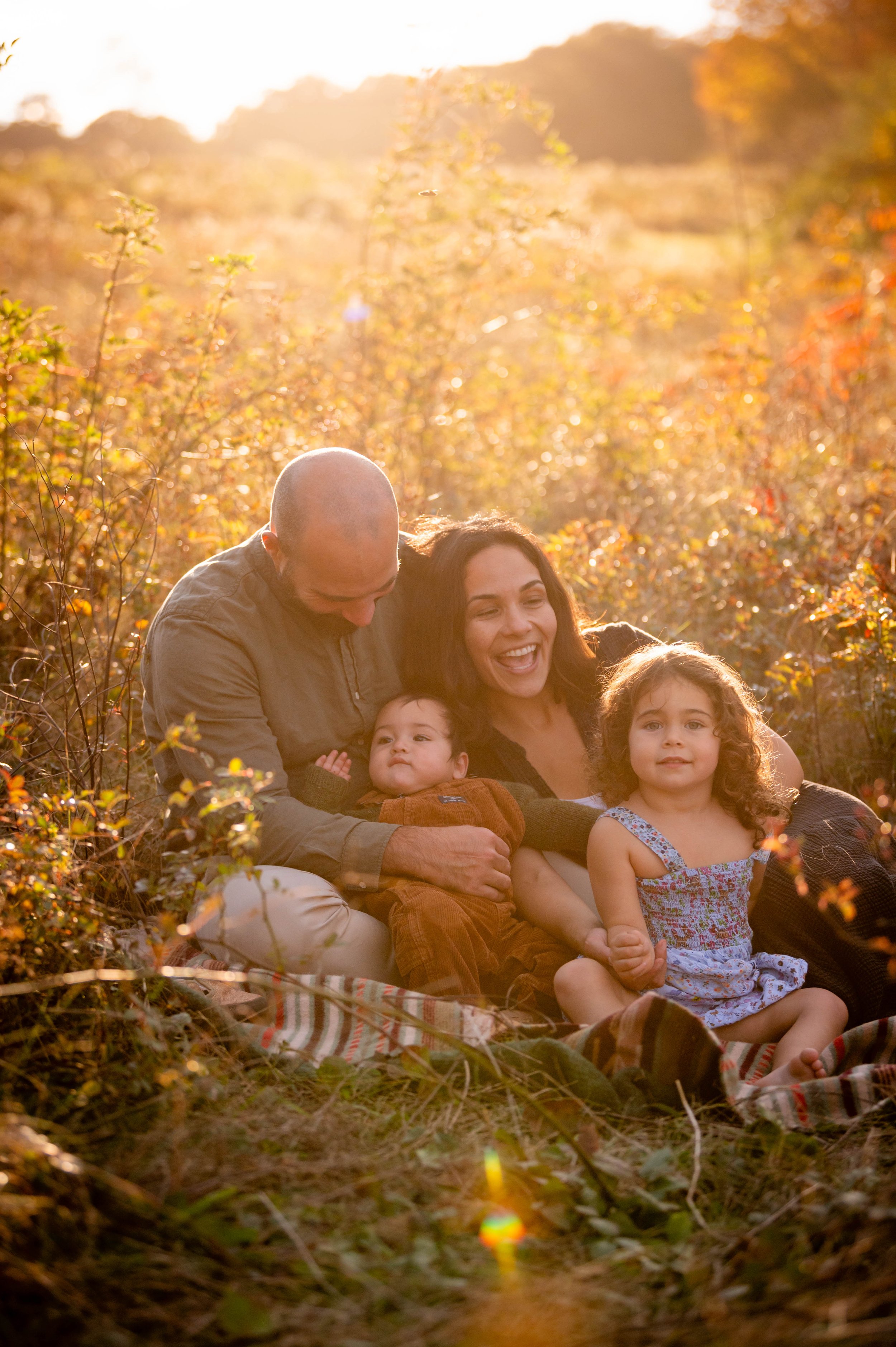 lindsay murphy photography | portland maine family photographer | family cuddling in field golden light.jpg