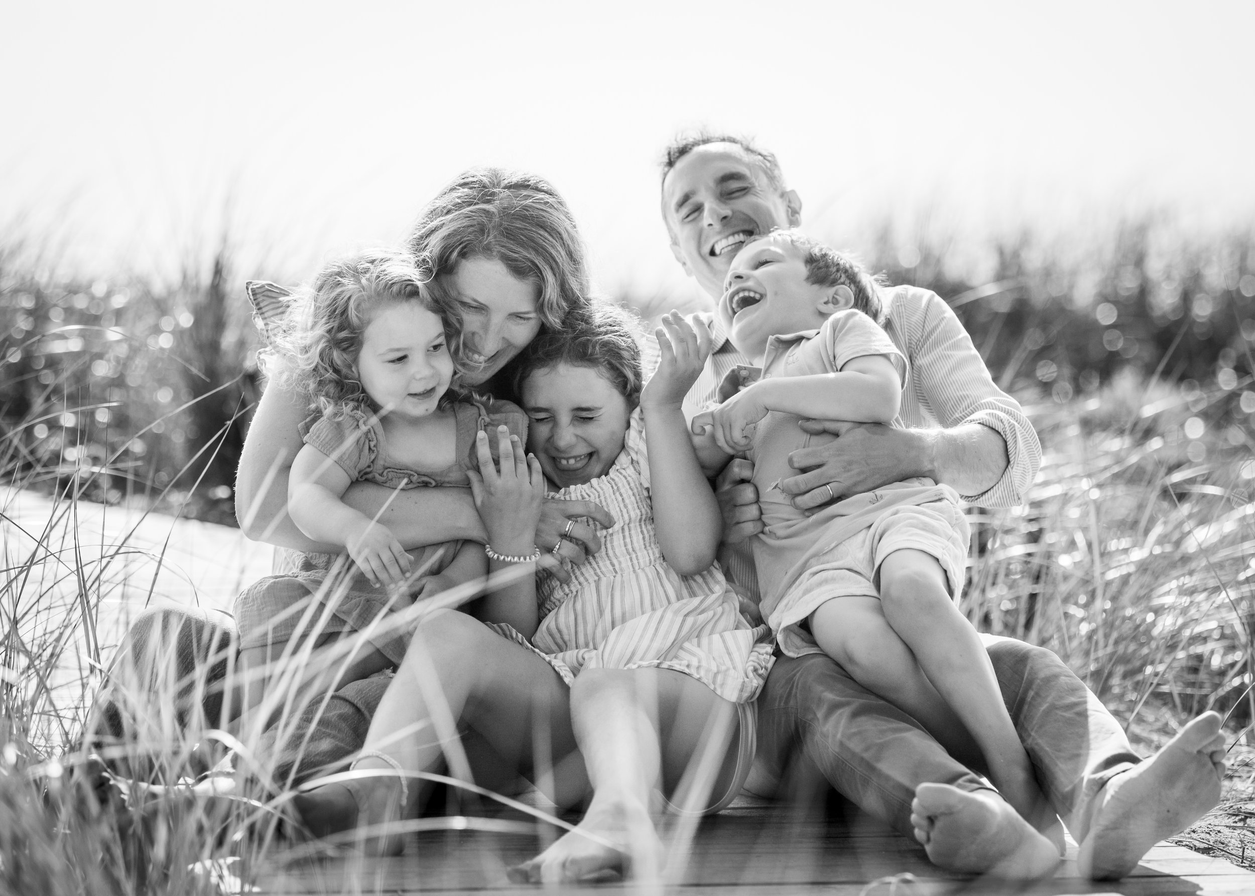 lindsay murphy photography | portland maine family photographer | family laughing on boardwalk prouts neck scarborough.jpg